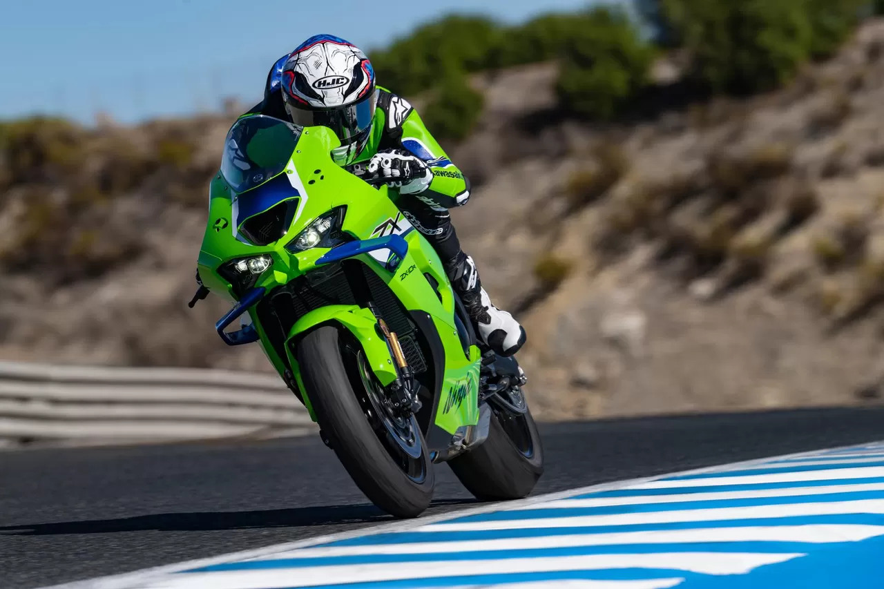 Rider cornering on a Lime Green Kawasaki Ninja ZX-10R at a racing circuit